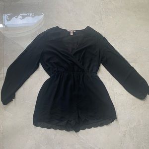 Black scalloped romper with embroidered accents